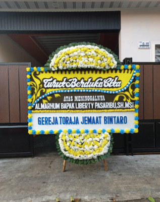 Papan Bunga Duka di Wama
